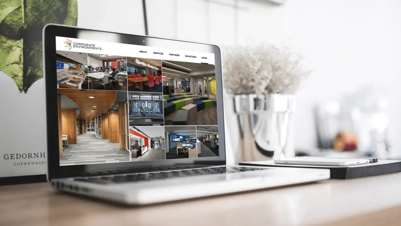Corporate Environments website on laptop computer