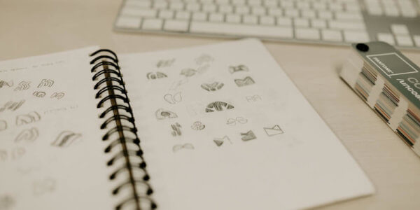 Sketches and examples of design logo in black and white