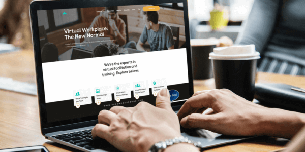 Man typing on computer showing example of organizing your website
