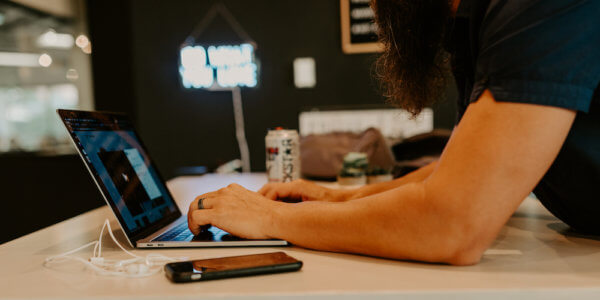 Typing on a laptop showing ways to clean your email lists