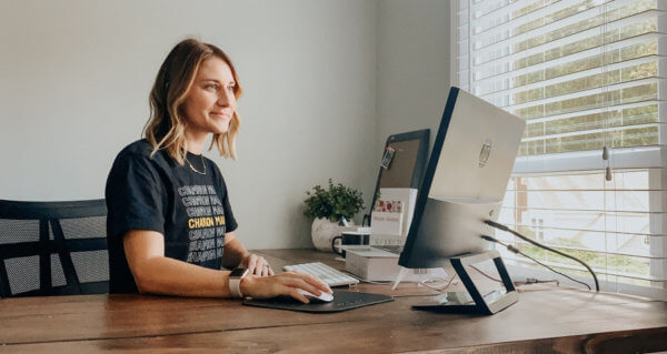 Girl typing on computer winning over b2b prospects
