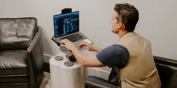 Man typing on laptop computer in his email inbox to increase email open rates