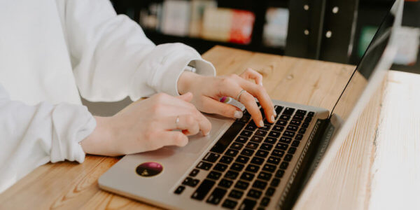 Typing on laptop computer learning how to engage an audience