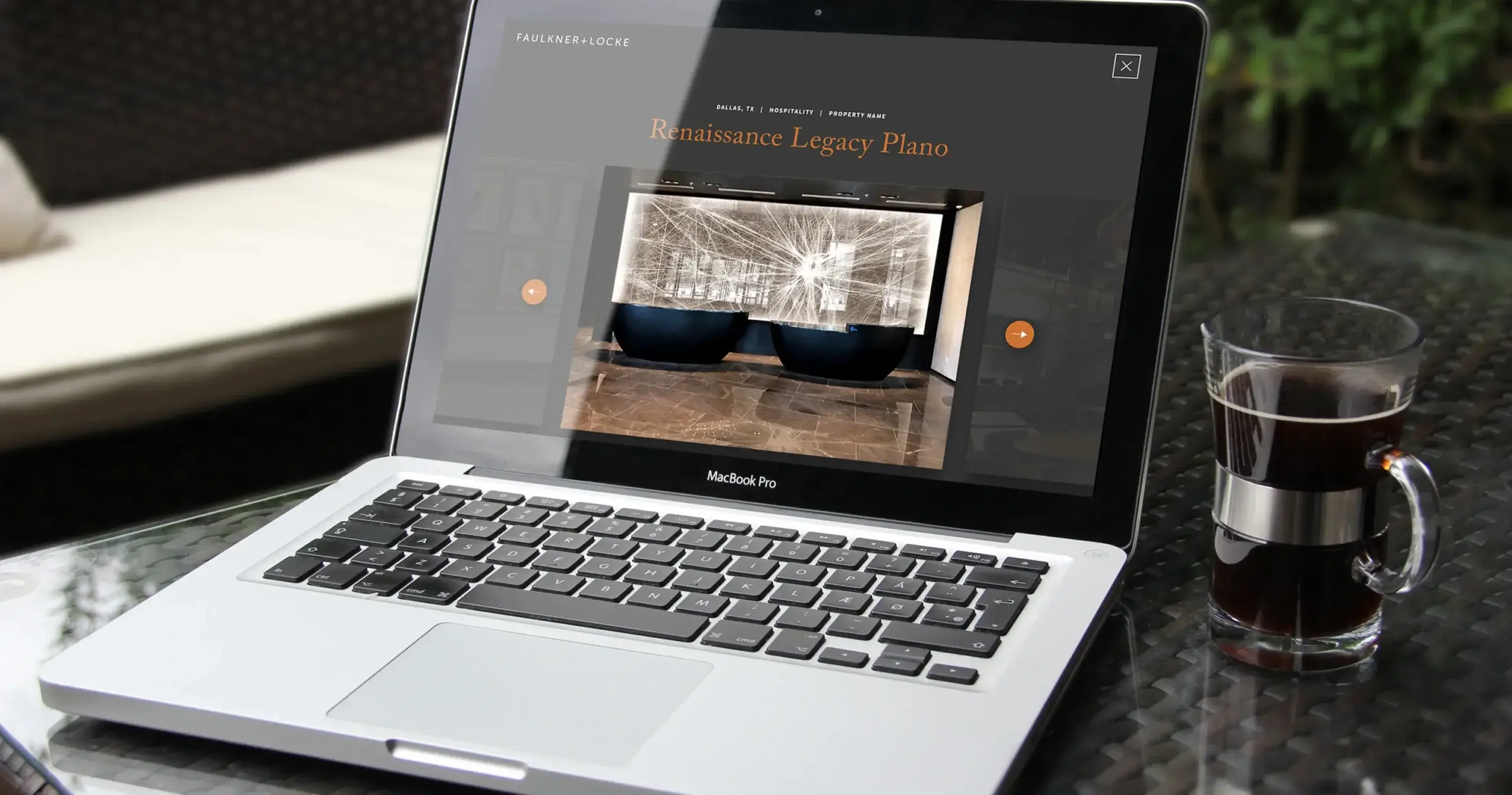 Faulkner & Locke website shown on laptop computer