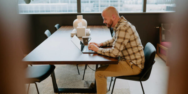 Lars, Syrup developer, looking at his laptop computer