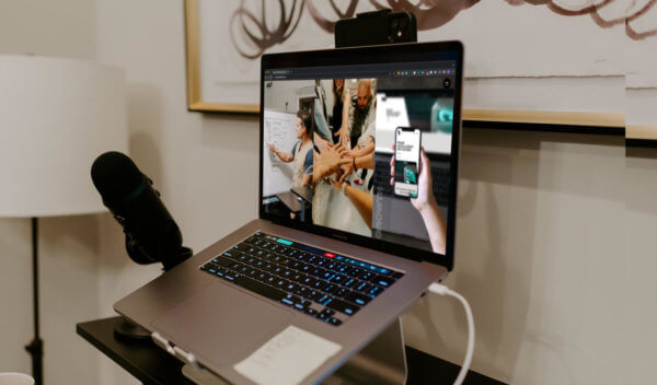 View of laptop set up with syrup unique message displayed on the screen - Giving B2B Companies Focus, Confidence, Growth