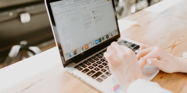 Hands typing on a laptop computer showing automation in action