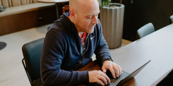 Jason typing on his laptop computer during his Q4 exercise