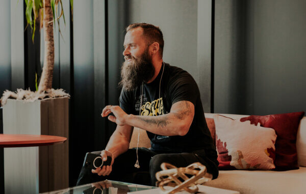 Benj sitting on a couch talking about boosting marketing conversions