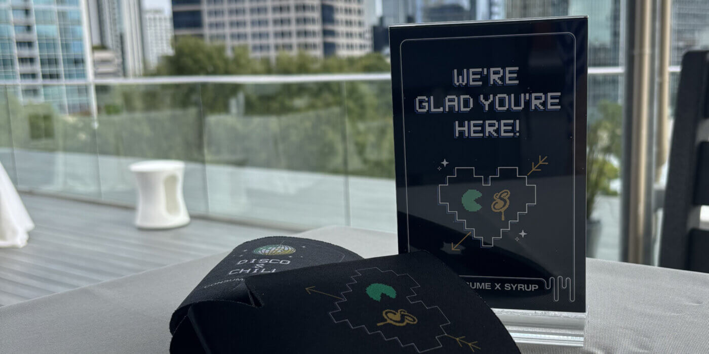 Image from event showing sign that says "we're glad you're here"