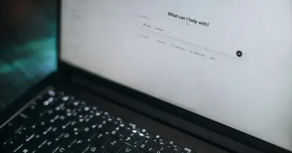 Computer with AI prompt on screen