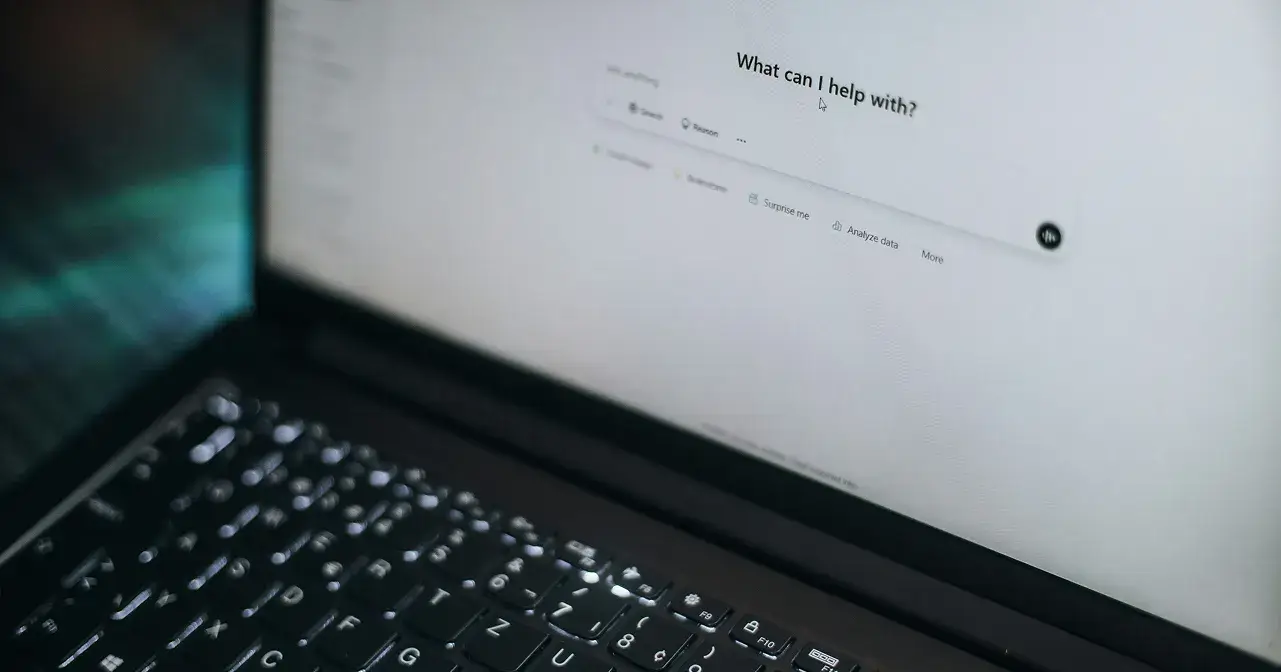 Computer with AI prompt on screen