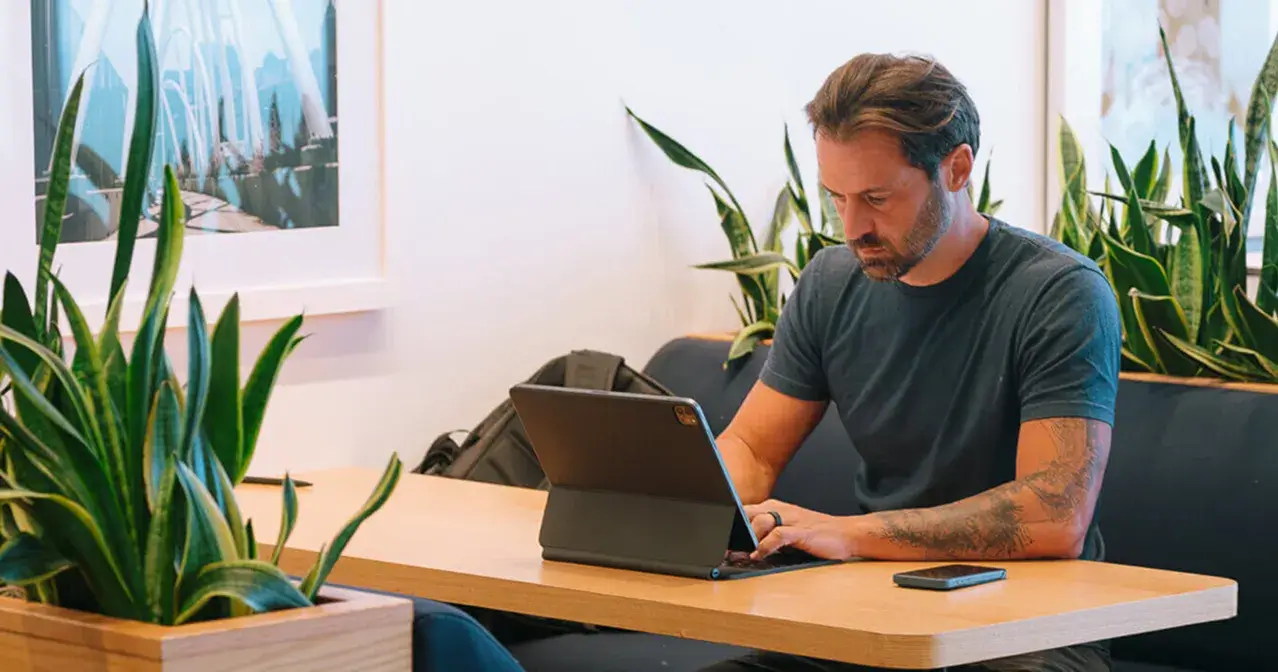 Benj Miller working on computer in office