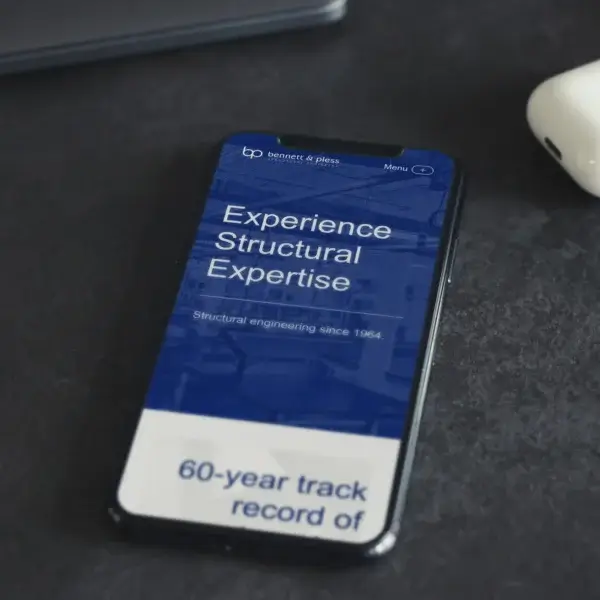 Bennett & Pless website shown on mobile device