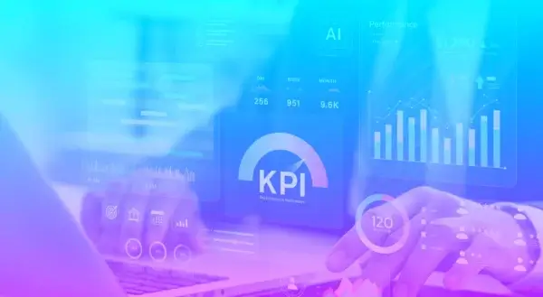 Person typing on computer with modern B2B marketing KPI showing with graphs