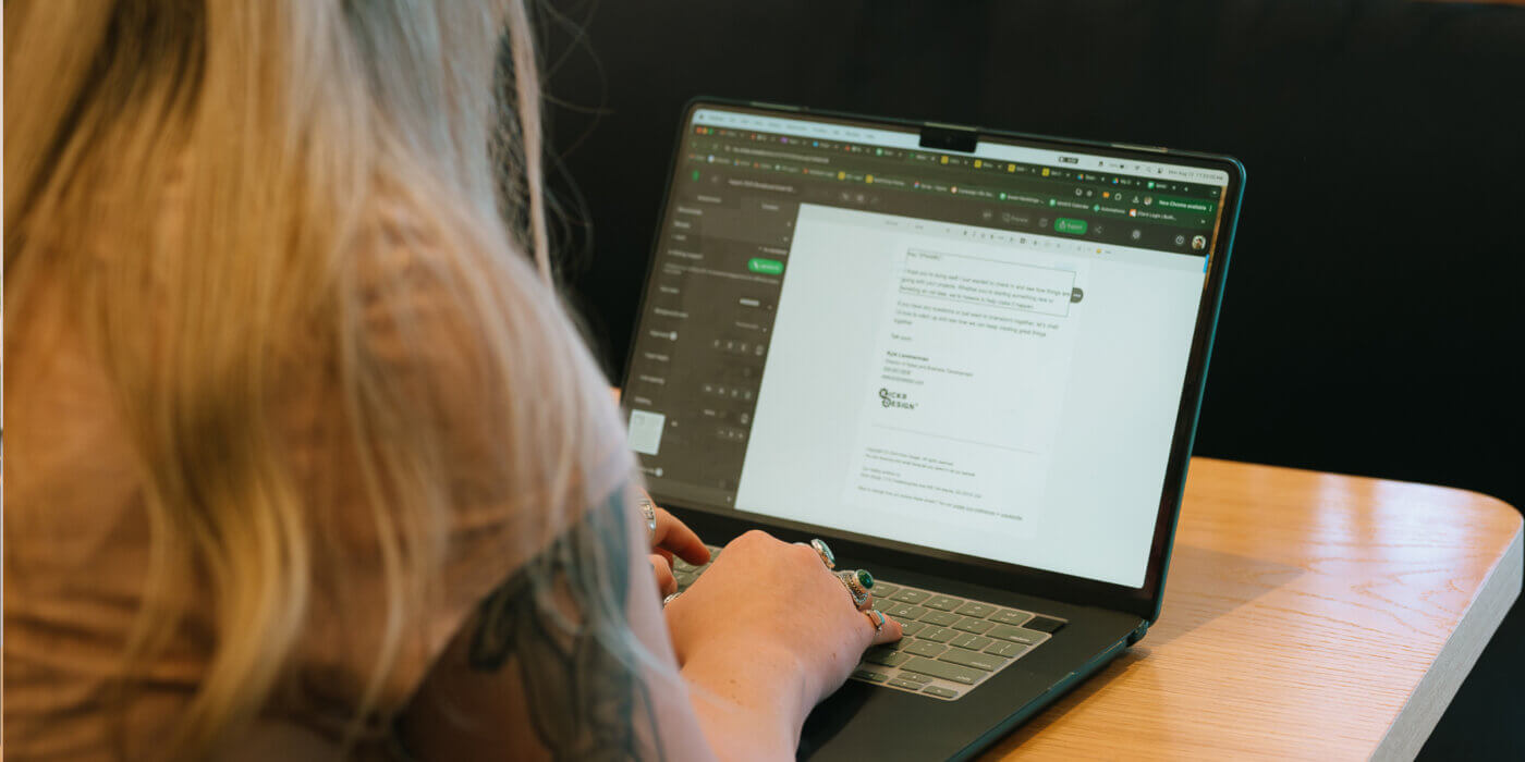 Woman typing on laptop with data, ai and privacy concerns