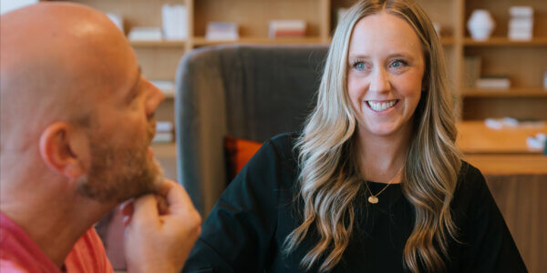 Kate smiling while talking to Jason about hiring a b2b marketing agency