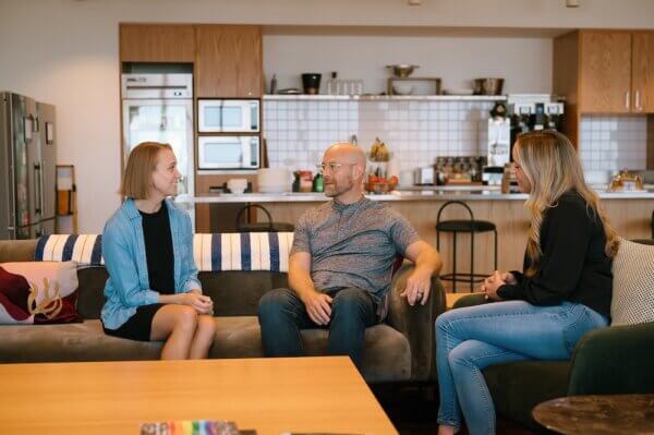 Jason, Kate and Jordan-Ann sitting on a couch discussing pipeline velocity